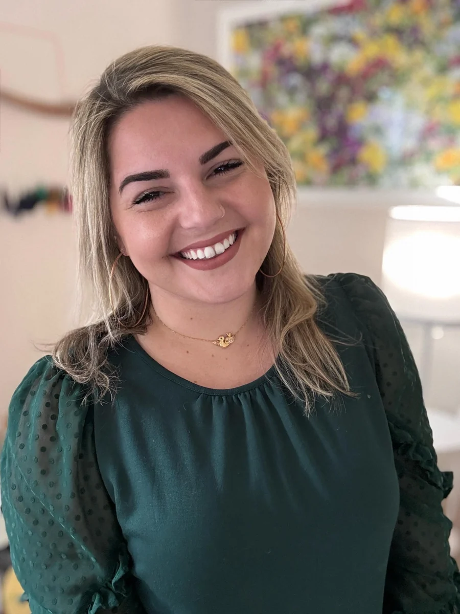 Belle McCaffrey smiling, wearing a dark green blouse